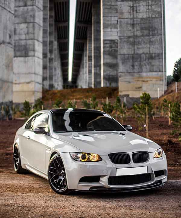 white-sport-car-standing-bridge copy
